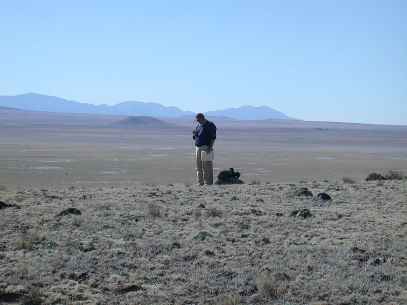 Matt Hill (UA graduate student in Anthropology) overlooking the C-N Basin during his survey of the area (V.T. Holliday).